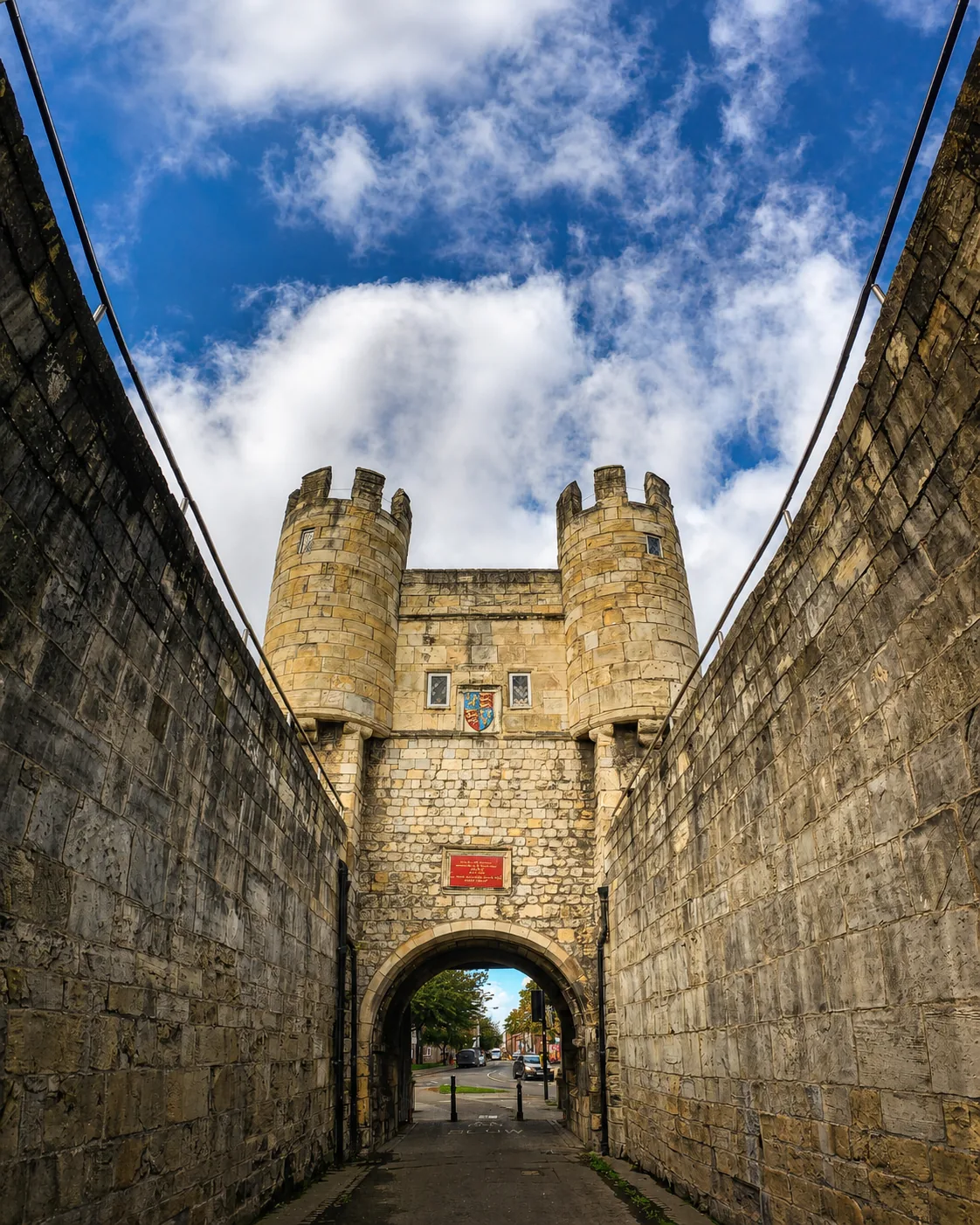 Walmgate Bar towers viewed through the stone passage